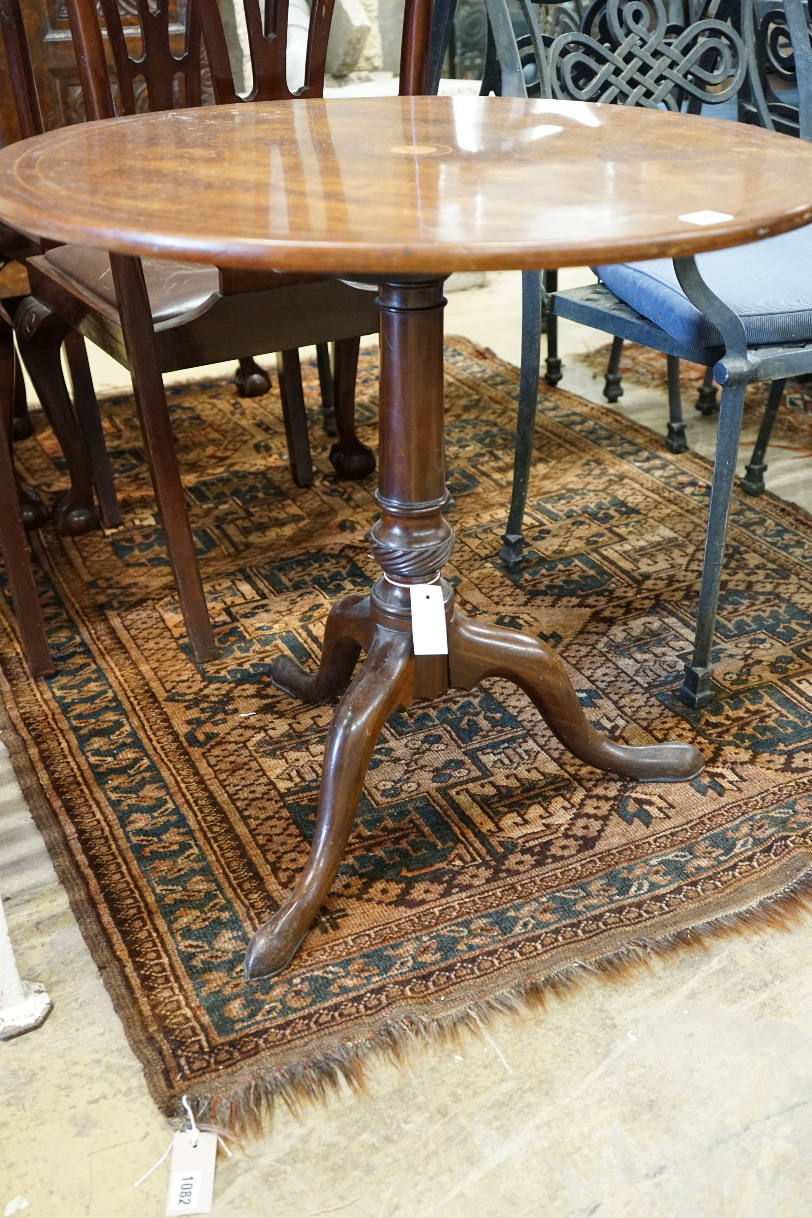 A George III inlaid mahogany circular tilt top tea table, diameter 72cm, height 69cm